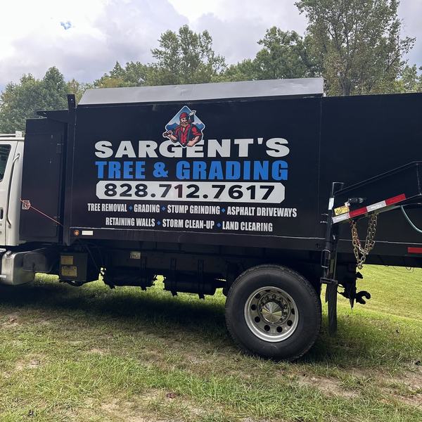 Sargent's Tree & Grading dump truck with the company logo and phone number